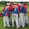 Samoan boys huddle in for a cheer