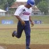 Areta Aukuso runs accross home plate after stealing second base and advancing on a wild throw