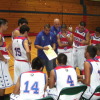 Sid Guzman discuss game plan with the team