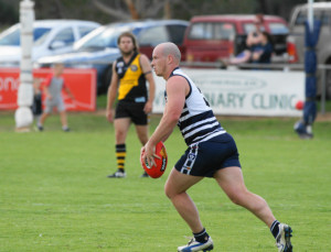 Ian Kay looks to rebound the ball from the defensive 50.